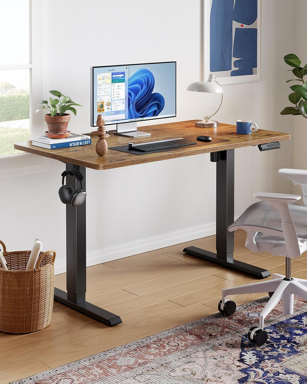 Discover the benefits of the Huanuo 55" x 24" electric standing desk, designed to enhance productivity and ergonomics in your home office. With its electric height-adjustment mechanism, ample surface area, sturdy frame